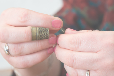 Close up photograph of Jenny Adin-Christie's hands as she works.